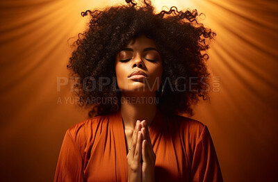 Low angle of Black woman praying hands folded. Religion concept.