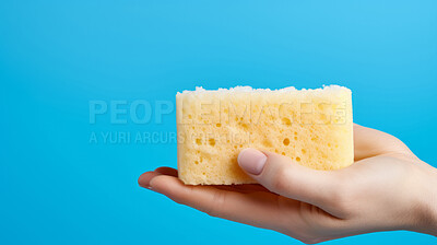 Buy stock photo Hand holding a sponge. Clean home and kitchen copyspace background