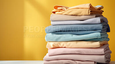 Buy stock photo Stack of colorful folded clothing items. Clean laundry copyspace background