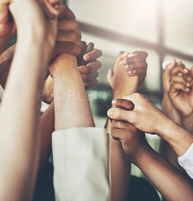 Buy stock photo Cropped shot of a group of businesspeople holding hands