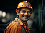 Happy Indian construction site worker looking at camera smiling. Construction concept.