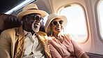 Mature couple on first class private jet. Luxury vacation travel concept.