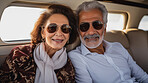 Mature couple on first class private jet. Luxury vacation travel concept.