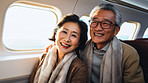 Mature couple on first class private jet. Luxury vacation travel concept.