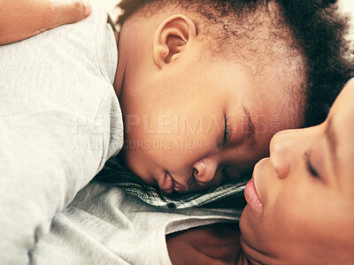 Buy stock photo Shot of a mother cradling her little baby boy