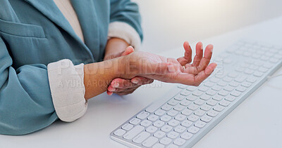 Business woman, hands and wrist pain from carpal tunnel syndrome, typing or injury on office desk. Closeup of female person with sore arm, inflammation or discomfort and joint ache at the workplace