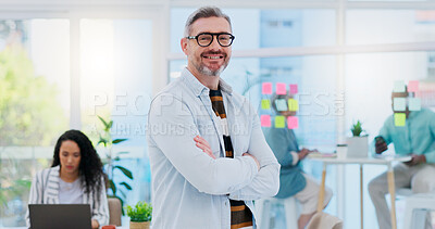 Happy, business pride and a man with arms crossed at a creative agency for consulting and design. Smile, confident and face portrait of a mature leadership management with technology for creative consultation