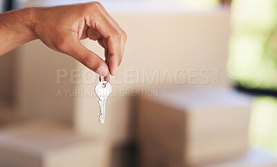 Buy stock photo Shot of an unidentifiable man holding up his house key on moving day