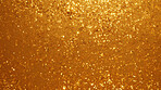 Gold glitter sparkling shiny wrapping paper background. Wallpaper decoration