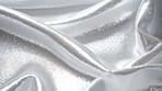 Silver glitter wave material. Metallic textile design background