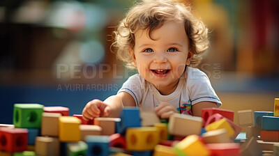 Buy stock photo Portrait of a happy toddler playing with building blocks at kindergarten or playroom.