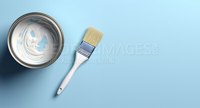 Top view of open can of paint with paint brush. Copy space. Pastel blue backdrop.