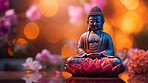 Close-up of small buddha statue with vibrant colour. Meditation, religion concept.