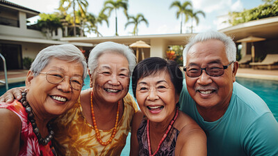 Senior friends by hotel pool. Active holiday fun, fitness and longevity