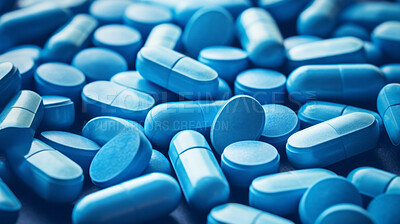 Blue pills background. Health supplement and science medicine research concept