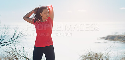 Buy stock photo Cropped shot of an attractive young woman warming up before a workout