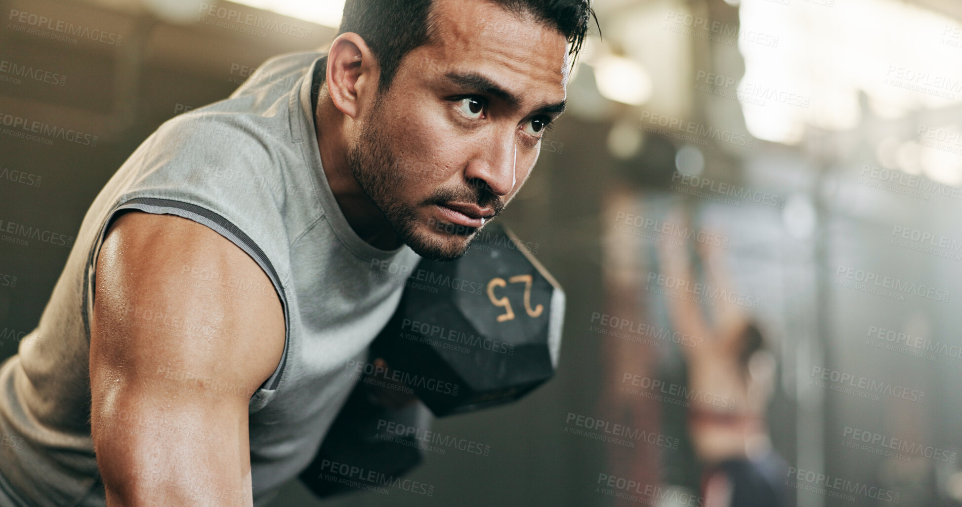 Buy stock photo Serious man, dumbbell and weightlifting in workout, exercise or fitness at indoor gym. Active male person, bodybuilder or athlete lifting weight for intense arm training, strength or muscle at club