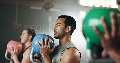 Buy stock photo Gym, group fitness and kettlebell squat exercise for power, sports challenge and muscle. Serious asian man, bodybuilder and heavy weights for training in health club, workout class and strong friends