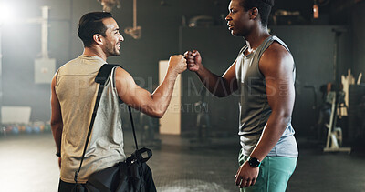 Teamwork, friends and fist bump with people in gym for motivation, support and workout. Personal trainer, health and exercise with men in fitness center for training, wellness or performance together