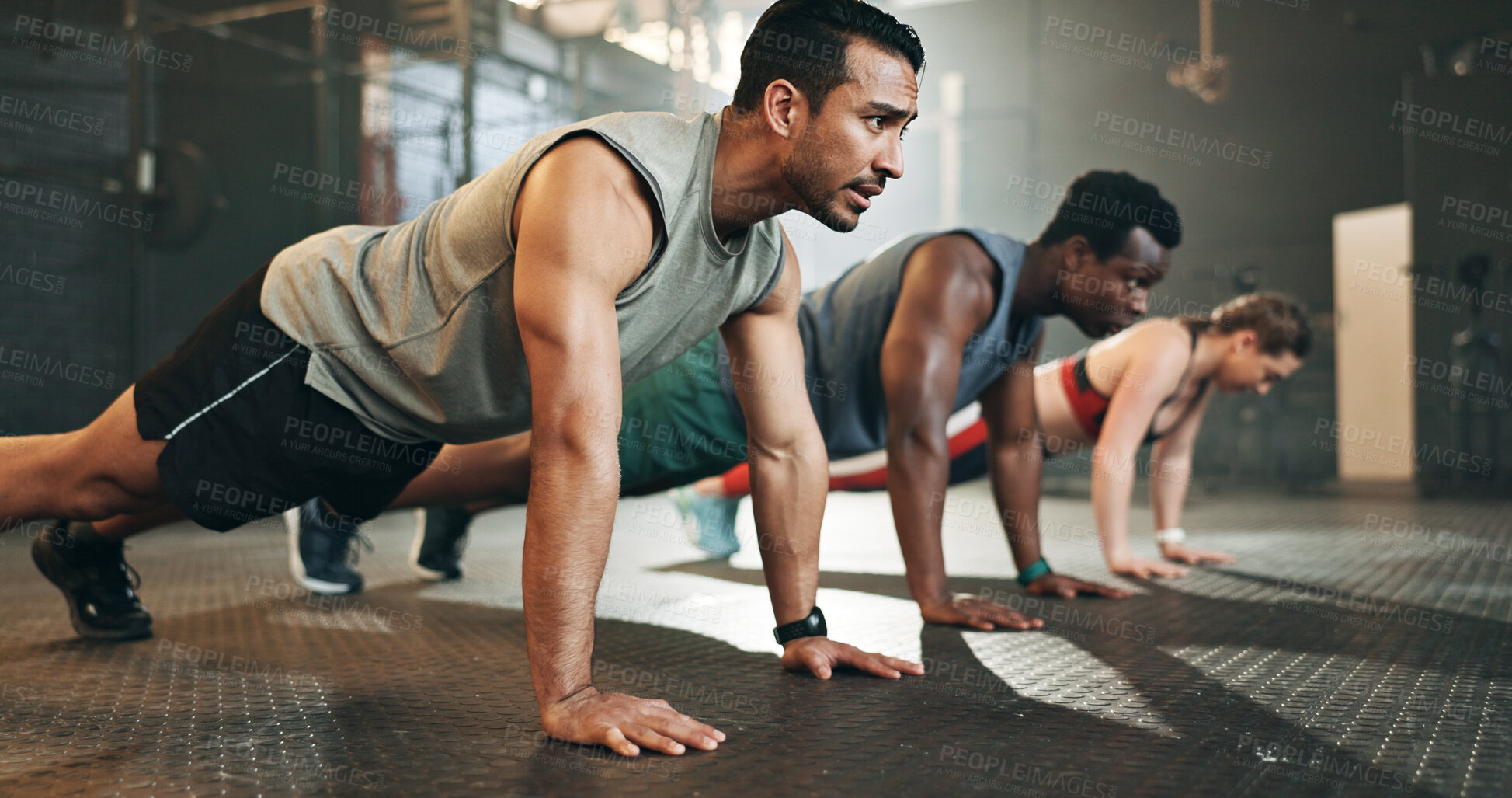 Buy stock photo Gym, group fitness and push up exercise for power, sports challenge and muscle on ground. Serious asian man, bodybuilder and performance training on floor with friends, workout class or strong people