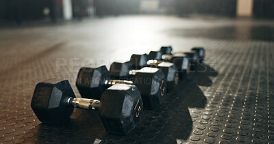 Buy stock photo Fitness, background and dumbbells in empty gym for exercise, bodybuilding workout and sports training. Closeup of heavy steel weights, equipment and iron on floor in wellness club for muscle power