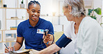 Caregiver, black man or old woman with blood pressure test consulting in hospital to monitor heart wellness. Healthcare, hypertension consultation or medical nurse with sick patient for examination