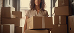 Young woman carrying large box during a move to new home or package delivery