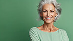 Radiant mature senior model woman with grey hair laughing and smiling for spa and dental