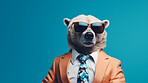 Bear wearing glasses and suit for office style or business against a blue background