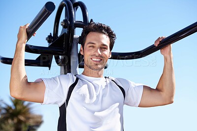 Buy stock photo Happy man, fitness and portrait with equipment at park gym for workout, exercise or training in nature. Fit, active and strong male exercising on outdoor machine for strength or weightlifting