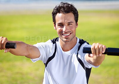 Buy stock photo Shot of a handsome young man exercising