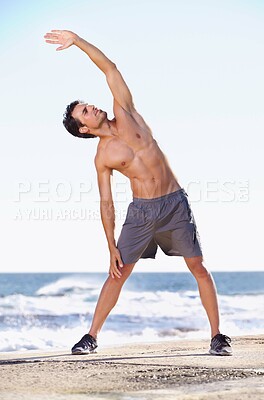 Buy stock photo Fitness, man and stretching body on beach getting ready for exercise, workout or training in nature. Fit, active or muscular male exercising in warm up stretch for healthy cardio or wellness by ocean