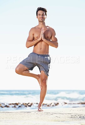 Buy stock photo Happy man, yoga and meditation in balance on beach for spiritual wellness, zen or tree pose in nature. Male yogi standing in namaste to meditate, relax or healthy body for inner peace by the ocean