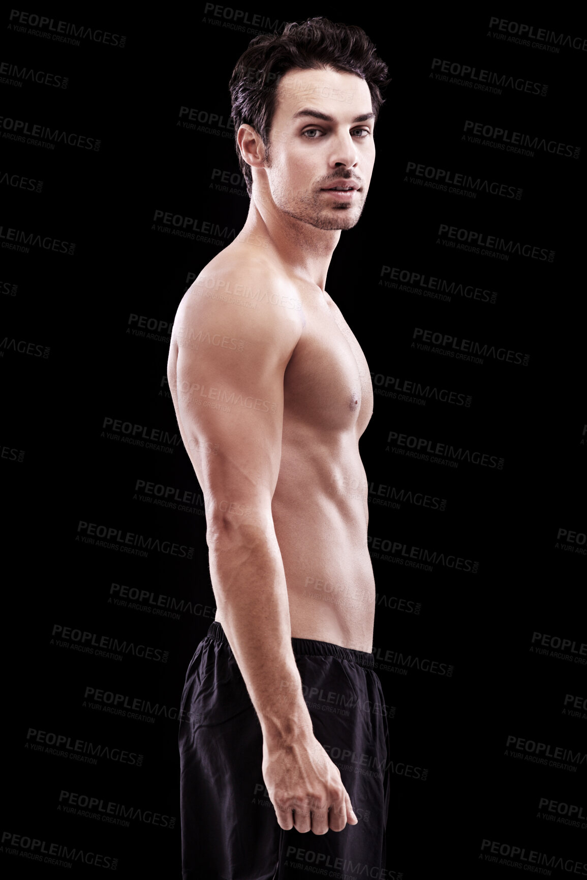 Buy stock photo Portrait, man and bare bodybuilder on black background, dark studio and muscular abdomen tattoo. Sexy, serious and strong male model, sports athlete and fitness power for exercise, training or muscle
