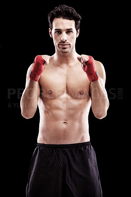 Buy stock photo Portrait, boxer and man with fists in bandage or focus, thinking and ready for boxing fight in isolated studio black background. Athlete, martial arts and healthy fitness, strong fighter and sports