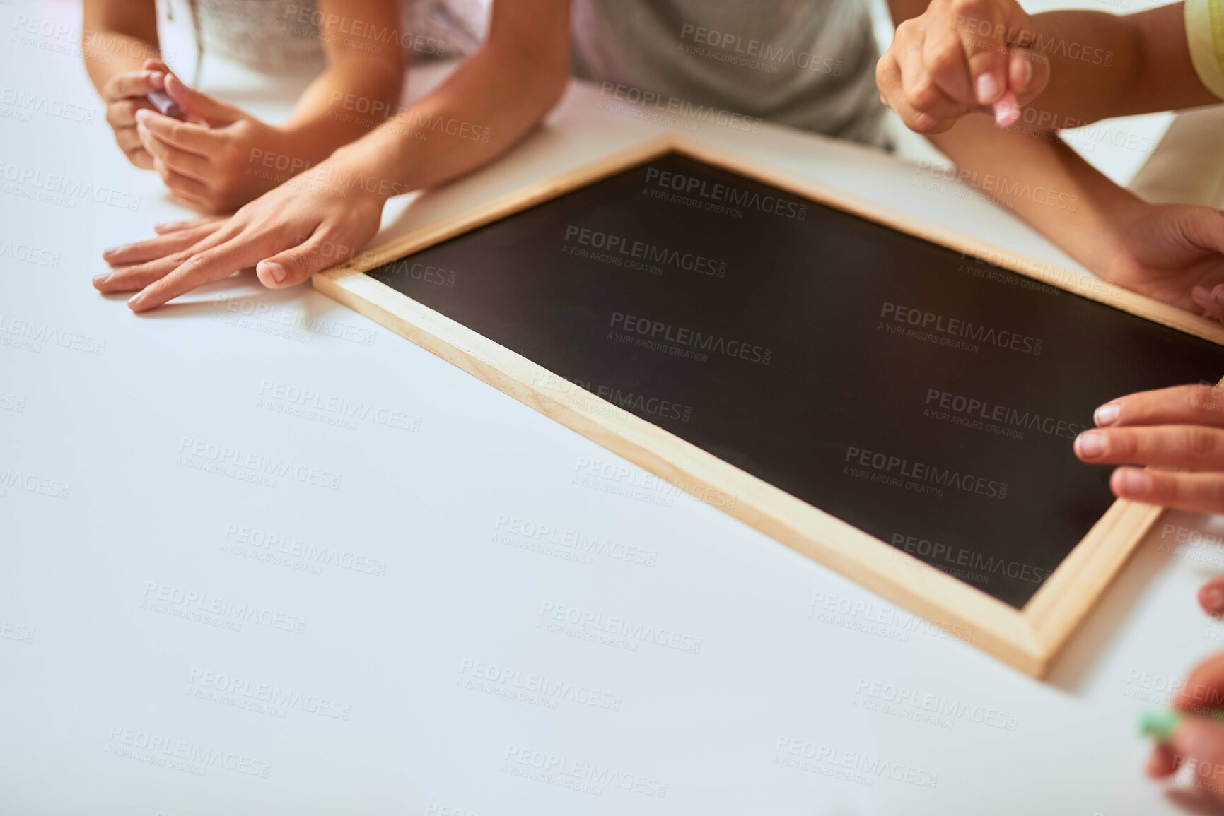 Buy stock photo Closeup shot of kids writing a list of chores on a chalkboard at home