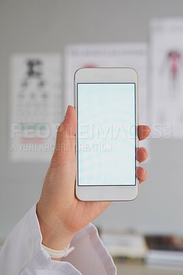 Buy stock photo High angle shot of an unrecognizable female doctor sending a text while working in the hospital