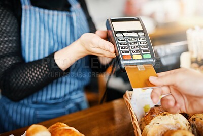 Buy stock photo Credit card payment, bakery and hands with a machine at a restaurant for a service or food. Cafe, pay and a customer paying or buying a product at a coffee shop with a transaction from a worker