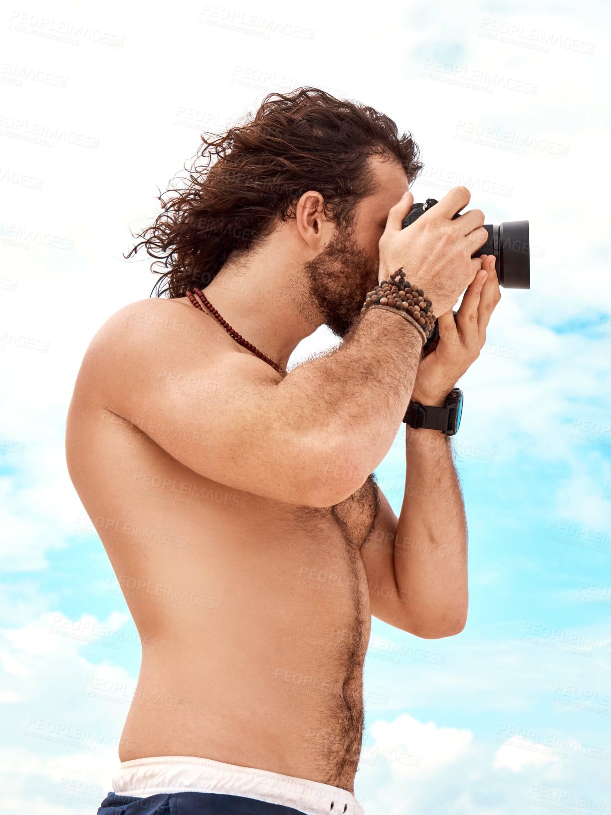 Buy stock photo Man, photographer and camera with blue sky and clouds in summer for photo or picture in nature outdoors. Shirtless male person in photography for memory, tourist or holiday weekend pictures outside