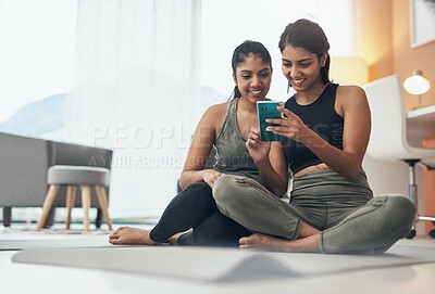 Buy stock photo Exercise, phone and women together at home with internet connection and social media. Indian sisters or female friends in lounge with smartphone for online class, chat or fitness workout with partner