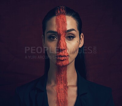 Buy stock photo Studio shot of a young woman posing with paint on her face on a black background