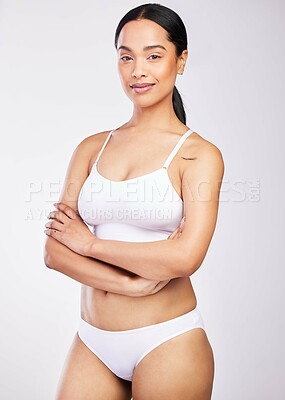 Buy stock photo Shot of a beautiful young woman posing against a white background