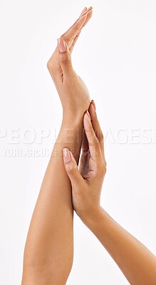 Buy stock photo Cropped shot of an unrecognizable woman rubbing her own arms in studio against a grey background