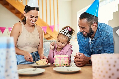 Buy stock photo Shot of a little girl celebrating a birthday with her parents at home