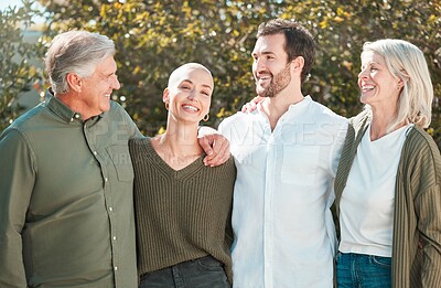 Buy stock photo Cropped portrait of an attractive young woman standing outside with her husband and parents