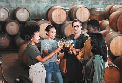Buy stock photo Friends, wine tasting or toasting alcohol with drink glasses in local farm distillery, winery estate or countryside room. Diversity, bonding or happy celebration people together with vineyard barrels