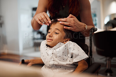 Buy stock photo Hairdresser, child with disability and wheelchair with hairstylist cutting his hair at salon. Young kid with cerebral palsy in Mexico getting professional haircut with scissors from beautician woman