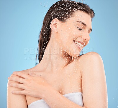 Buy stock photo Beauty, skincare and water with woman in shower for cleaning, hygiene and relax. Self care, wellness and cosmetics with girl model for product, facial and hydration in blue background studio