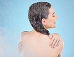 Shower, happy and beauty of wellness woman with body cleaning, self care and grooming routine. Health, hydration and water drops on back of skincare model washing in blue studio with smile.