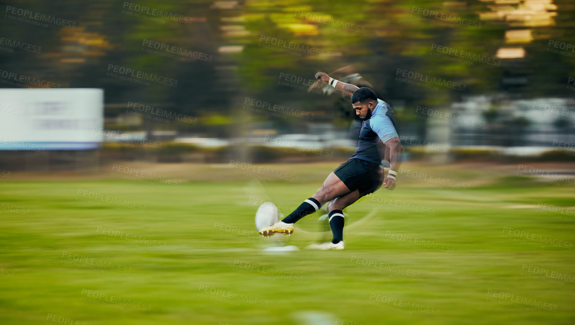 Buy stock photo Rugby, action and black man kicking ball to score goal on field at game, match or practice workout. Sports, fitness and motion, player running to kick at poles on grass with energy and skill in sport